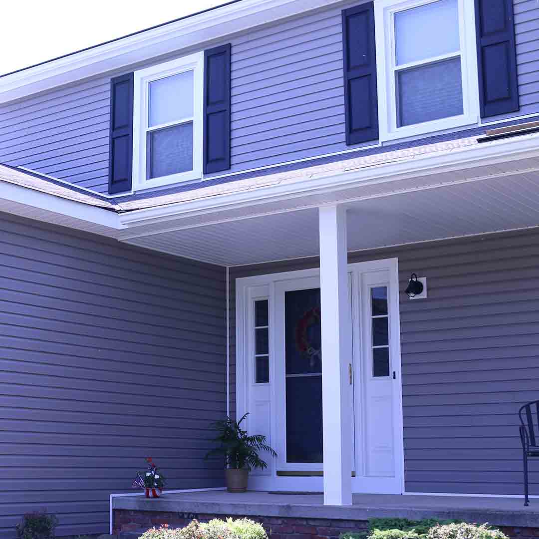 house with blue siding, dark blue shutters