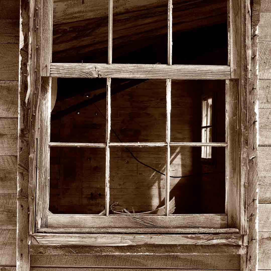 old house window failing with chipped paint