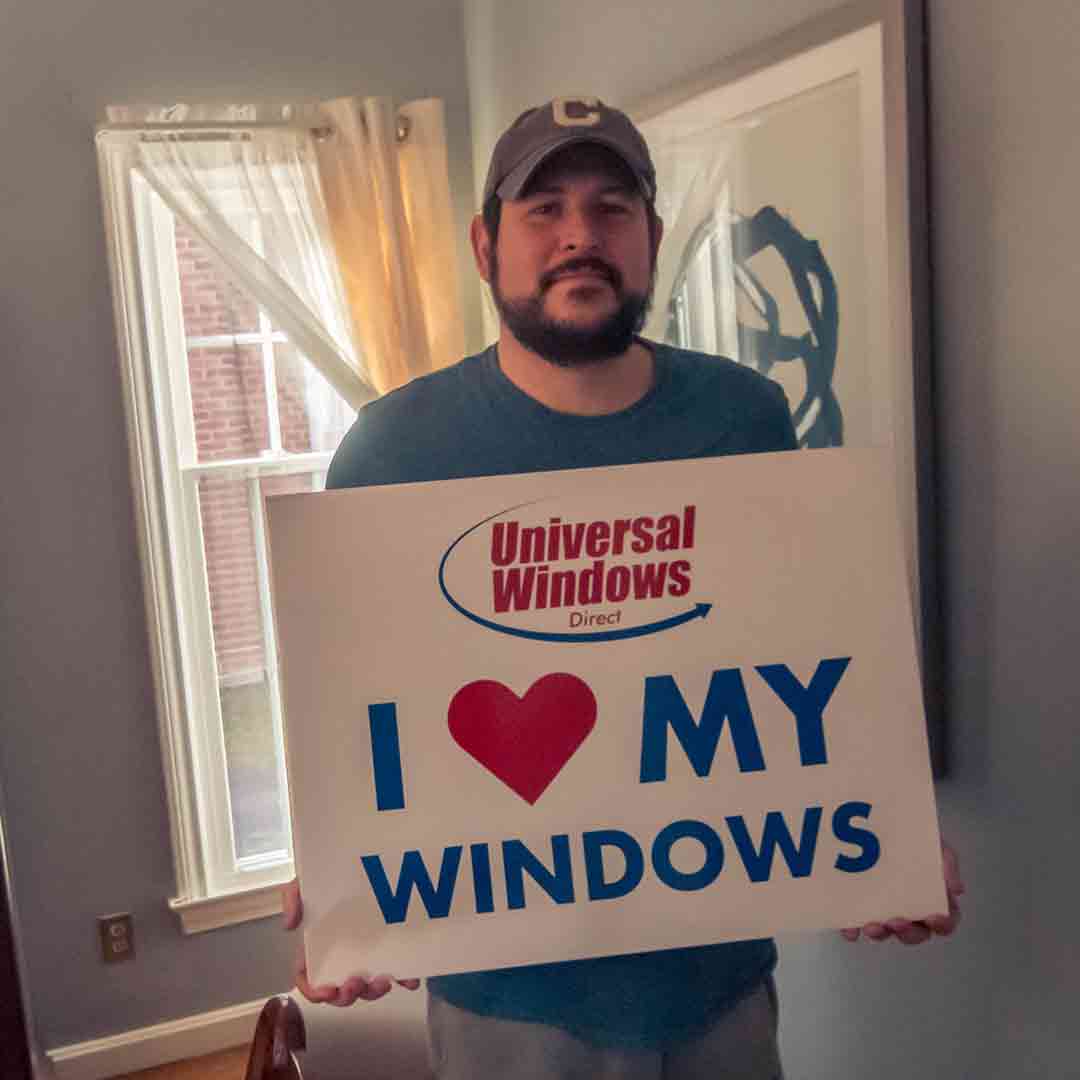customer holding I Love my Windows Sign