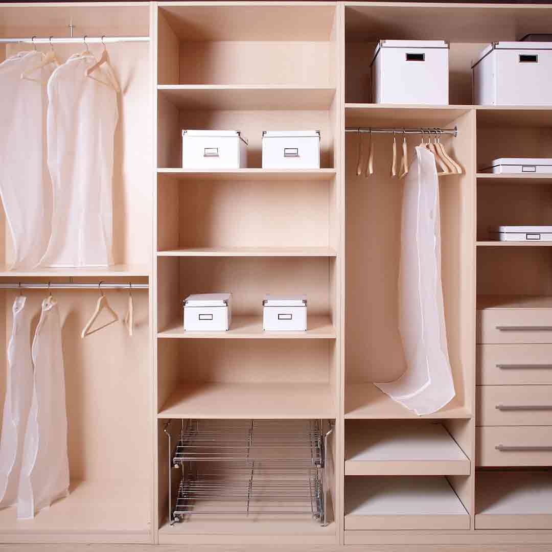 walk-in wardrobe organized with boxes and hangers