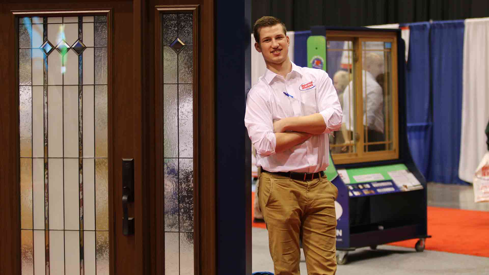 marketer at home show leaning on door