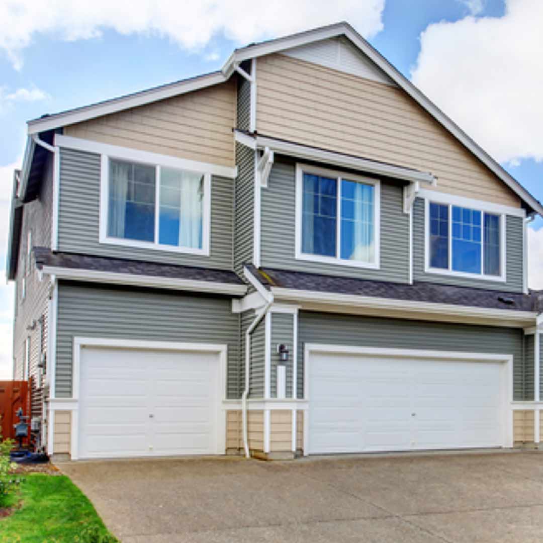 home with two-tone siding and 2 garages