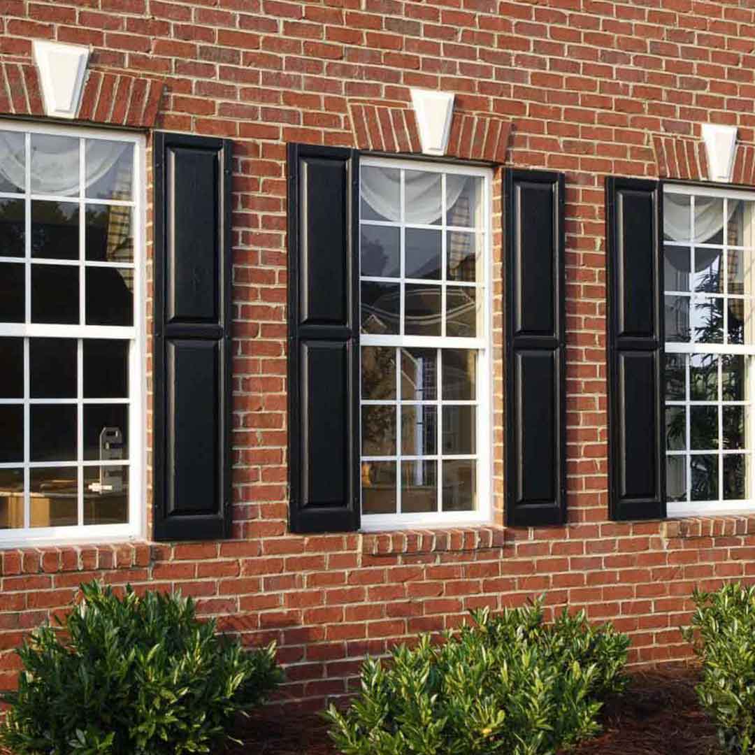 3 double hung windows with grids and shutters